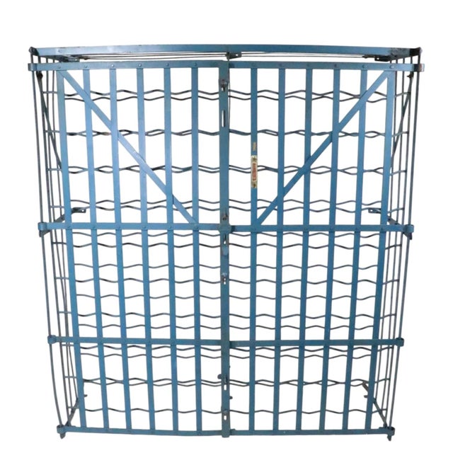 Classic French wine cage made by Ridigex. This example features two swing open doors, with original hasp latch, it holds...