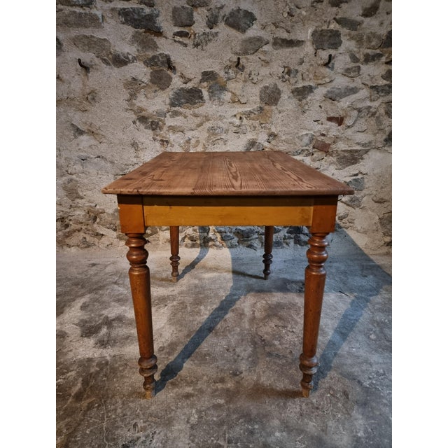 Origin: France Period: 1920s–1930s Materials: Pine (top and frame), Beech (legs) Finish: Original amber-toned shellac on...