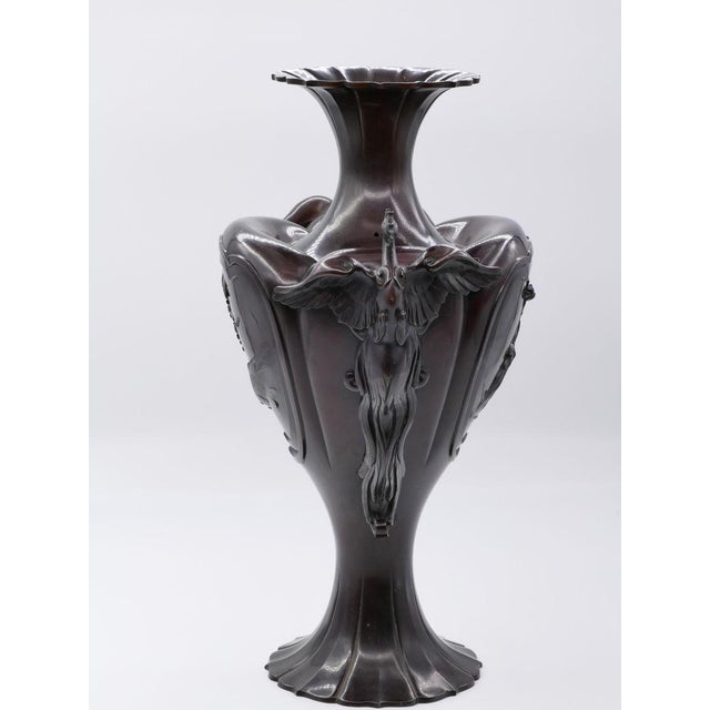 This Meiji bronze amphora is a superb bronze vase decorated with the depiction of flowers and frogs and on the sides a...