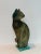 We are very pleased to offer a captivating raku pottery cat sculpture by American ceramic artist Tony Evans, signed by the...