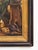 An atmospheric genre painting depicting a young woman sitting by a barrel in a country kitchen. The composition is very...