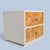 A compact vintage nightstand from the 1970s featuring a faux-burl laminate finish and streamlined chrome pulls. The...