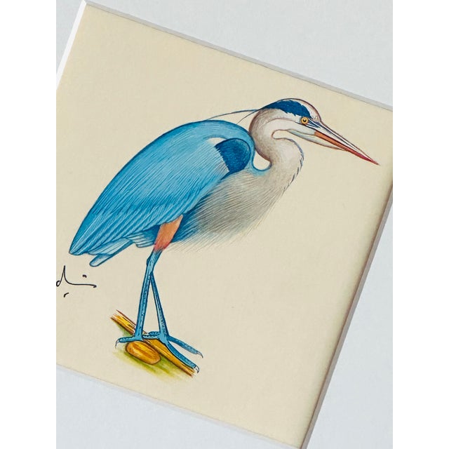 Our hand-painted heron—an elegant beauty full of charm and grace. His soft slate-blue feathers blend into delicate russet...