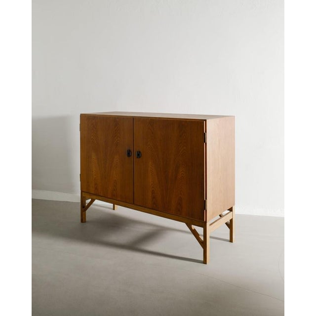 A rare danish mid century wooden "232" cabinet / sideboard in stained oak with brass details and handles by børge mogensen...