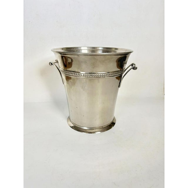 A French champagne bucket from the 1970s, crafted from stainless steel, boasts a simple yet elegant design. Slightly...