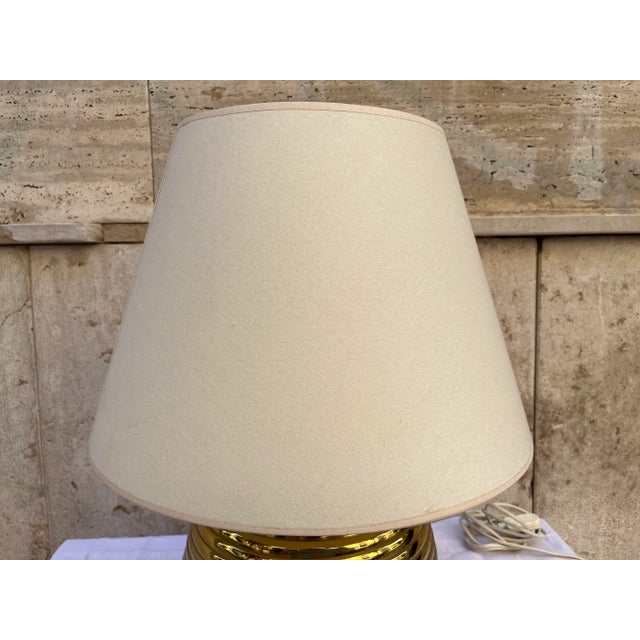 Vintage 1970s brass table lamp with beige lampshade Good condition with working electrical system Ideal for those looking...