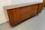A beautifully crafted example of American mid-century modern design, this Young Manufacturing walnut lowboy dresser...