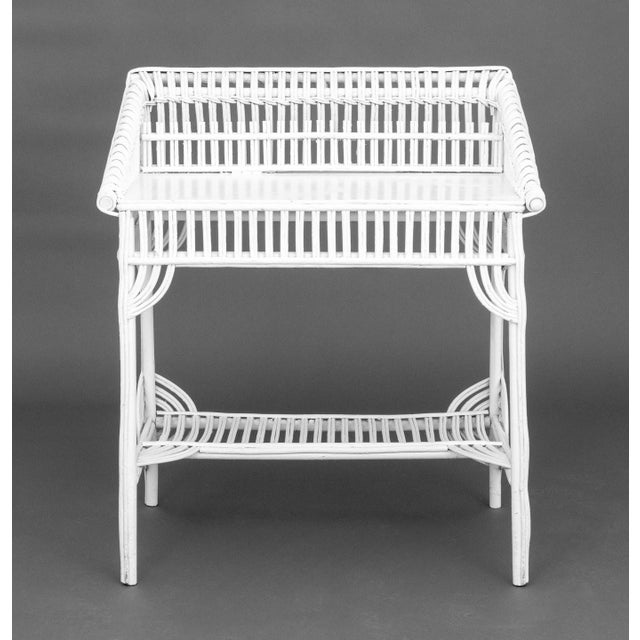 Vintage White Wicker Desk, with partial galleried writing service above undertier. 38.5" H x 33.5" W x 22" D. Provenance:...
