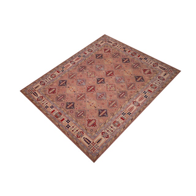 Enhance your home with this exquisite hand-knotted Kazak rug, crafted from fine hand-spun wool and dyed with all-natural...