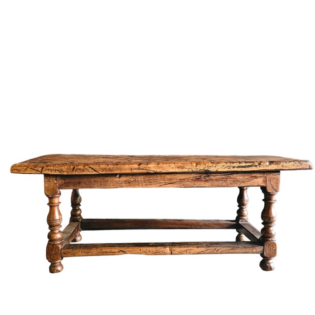 Gorgeous 18th Century French oak hall bench with turned legs perfect for use as a coffee table. Glowing finish, with all...