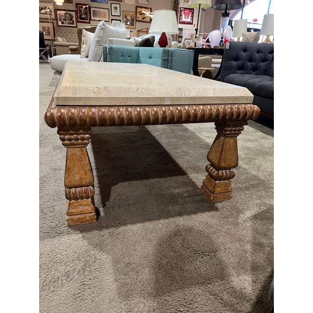 Timeless elegance meets organic sophistication in this stunning Kreiss travertine coffee table. Featuring a beautifully...