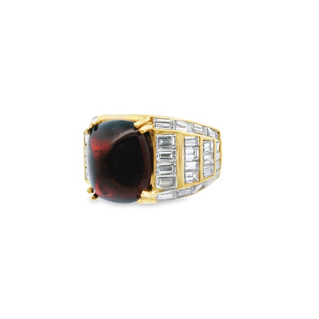 This bold contemporary ring boasts a stunning combination of 18k yellow gold, rich red garnet, and rows of rectangular...