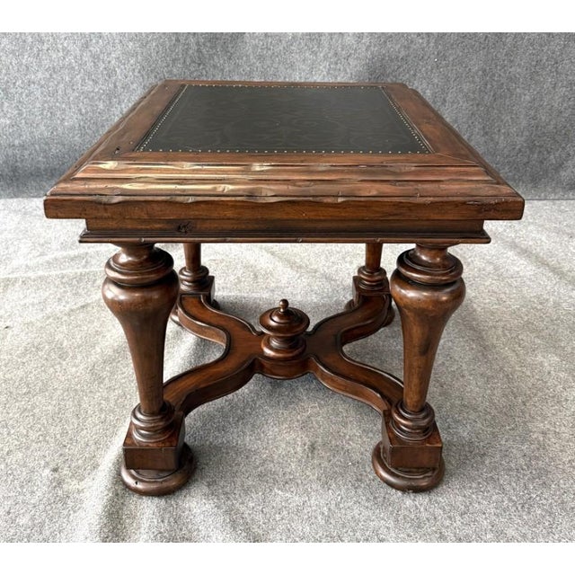 This Bernhardt side table features a richly detailed decorated top with an inset design framed by nailhead trim, set...