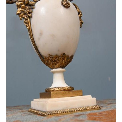 A fine and decorative pair of french ormolu and white marble candelabra, richly cast in the louis xvi taste circa 1890 in...
