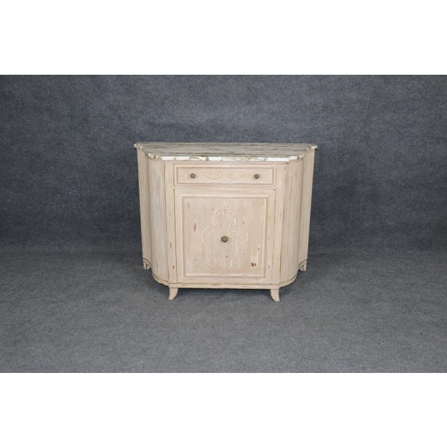 This antique Venetian style commode from circa 1950 is a beautiful example of refined European craftsmanship with timeless...