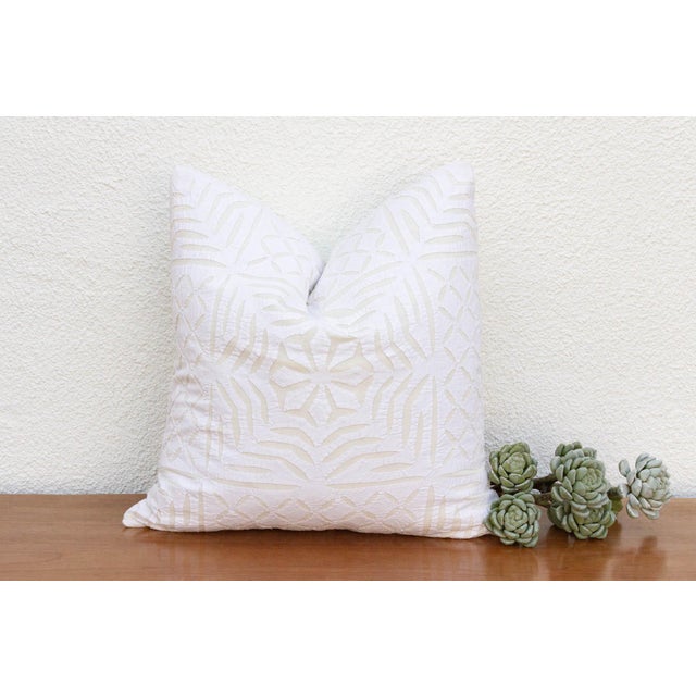 This decorative pillow cover features beautiful array of patterns, with hand crafted appliqué cut work, giving it a...