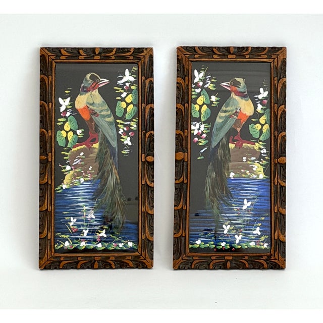 These mixed-media collages are created by pasting vibrant bird feathers directly onto a dark hand-painted background....
