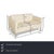 The Machalke sofa is covered in cream-colored leather and stands on narrow metal legs. The two-seater is characterized by...