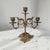 Antique three-light candelabrum executed in gilt metal and dating from the Art Nouveau period, circa 1900–1930. The design...