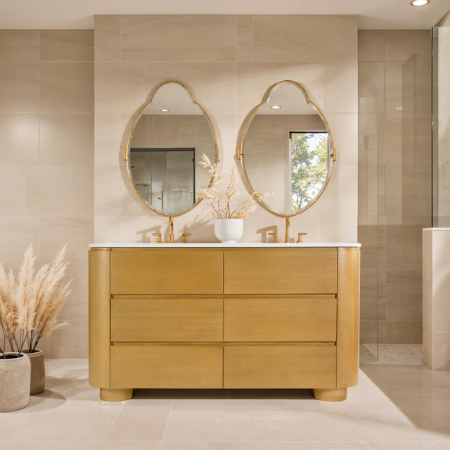 Transform your bathroom into a serene, spa-inspired retreat with the Butler Specialty Company Genoa double sink vanity....