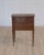 Made in France in the twentieth century, this Louis XVI style bedside or side table is constructed in walnut and opens at...