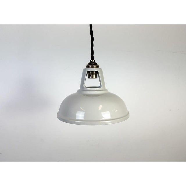 Vintage metal beige painted ceiling light in industrial style made in United Kingdom between 2000-2010. The brass socket...