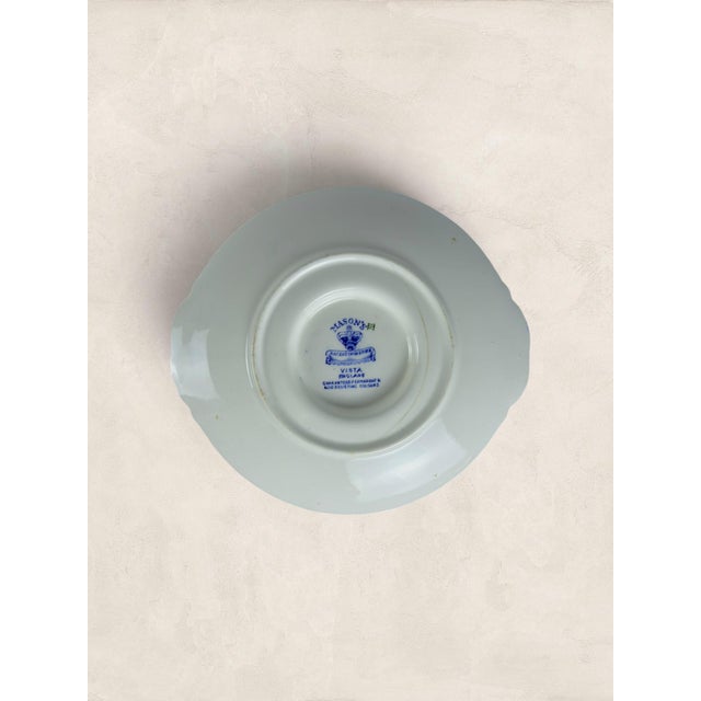 Antique English gravy boat and its original matching stand, both in Mason's classic indigo-on-white transfer print, this...