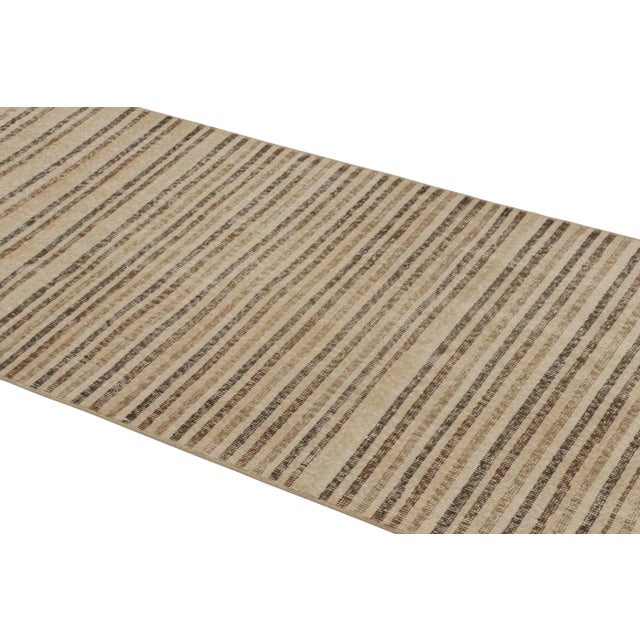 This vintage runner rug is a 3x7 Turkish distressed piece, made with hand-knotted wool circa mid-20th century. It is an...