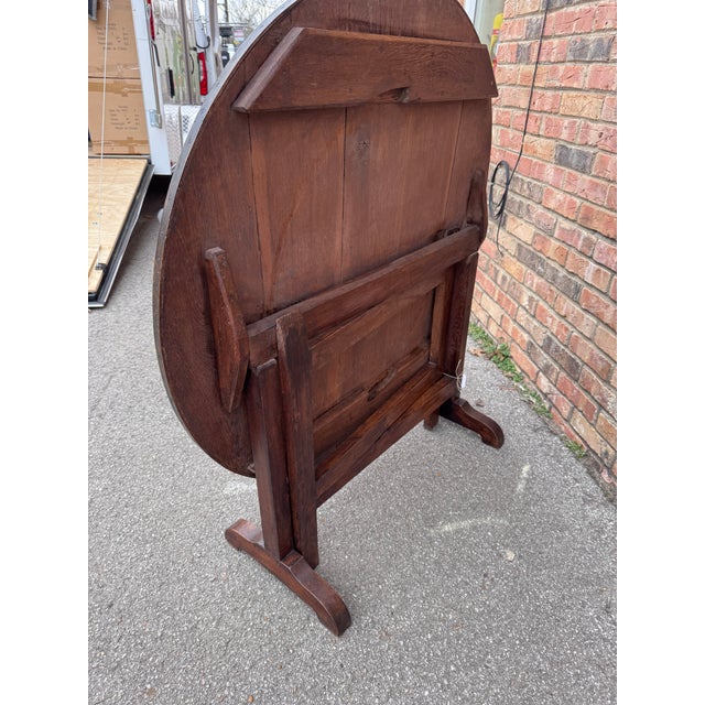 This 19th-century French wine table exudes timeless elegance, crafted with intricate detailing and deep rich wood. Its...