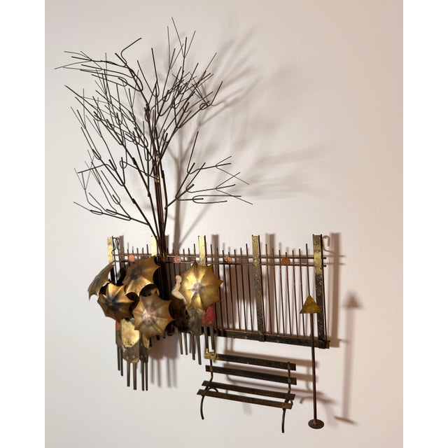 Large-scale mixed metal wall sculpture by Curtis Jere, dated 1972. Often identified as “Rainy Day at the Bus Stop,” the...