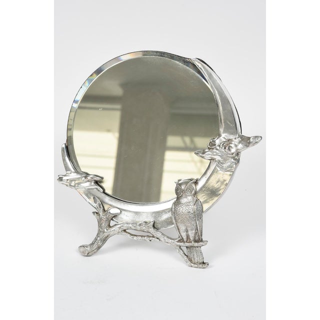 Beautiful dresser mirror with the original bevel glass mirror set into a figural three dimensional owl on a branch along...