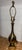 mid-century modern teardrop- or genie-form polished brass table lamp, resembling designs by makers like Laurel Lamp Co. or...