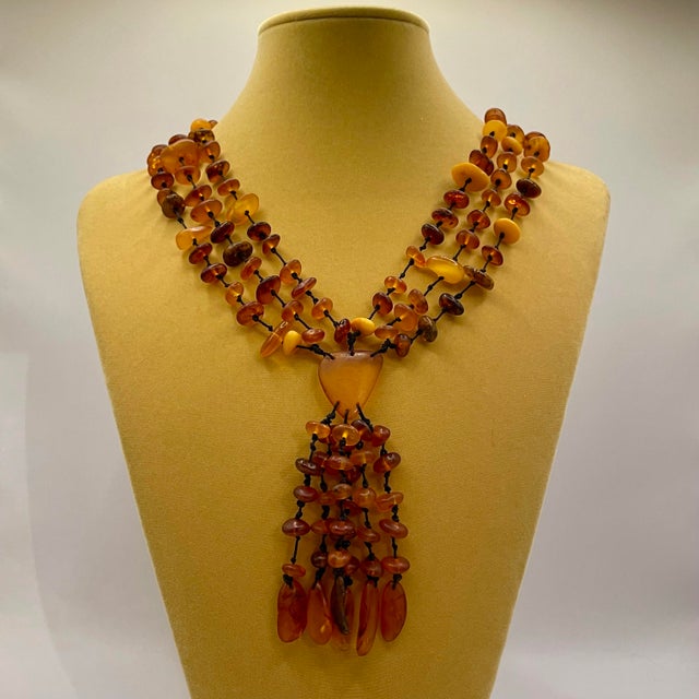Vintage genuine Baltic Amber multi strand necklace featuring individually knotted honey and butterscotch nuggets with...