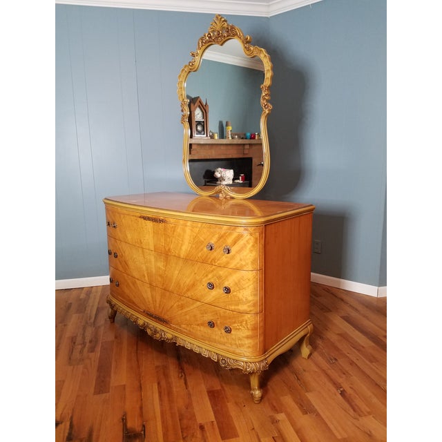 Elegant solid wood dresser/commode with gorgeous fan/sunrise design, dovetail drawers, and decorative trim. I believe the...
