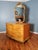 Elegant solid wood dresser/commode with gorgeous fan/sunrise design, dovetail drawers, and decorative trim. I believe the...