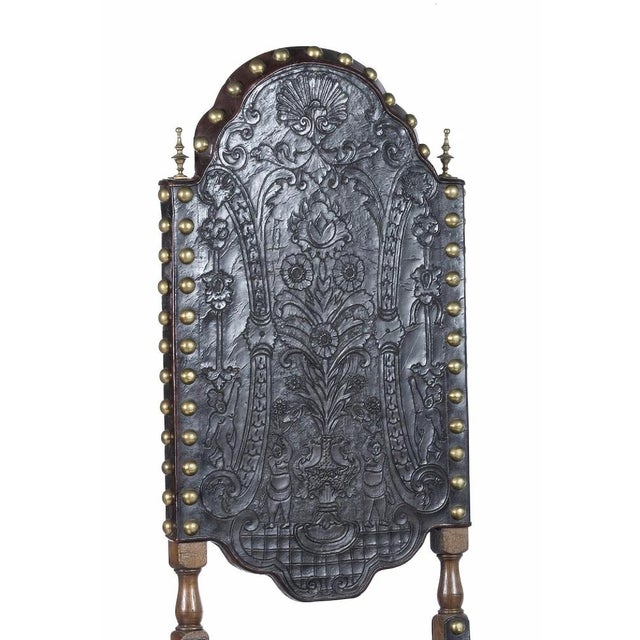 Pair of high-backed chairs portuguese, 19th century, in carved and turned chestnut wood, seats and backs in tooled leather...