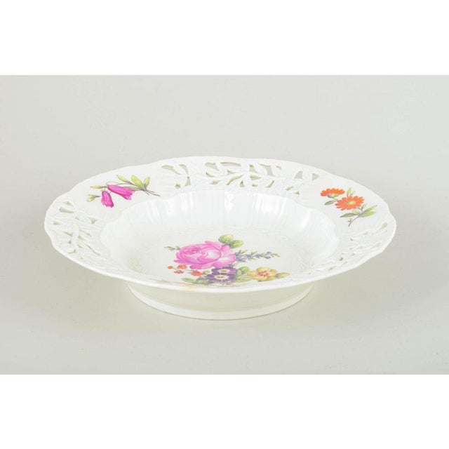 Royal Copenhagen Deep plate, early 20th century. Hand-painted porcelain with floral motif in multicoloured palette and an...