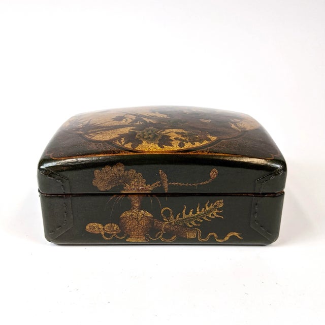 Intricately hand painted leather box. The top depicts two birds on a tree