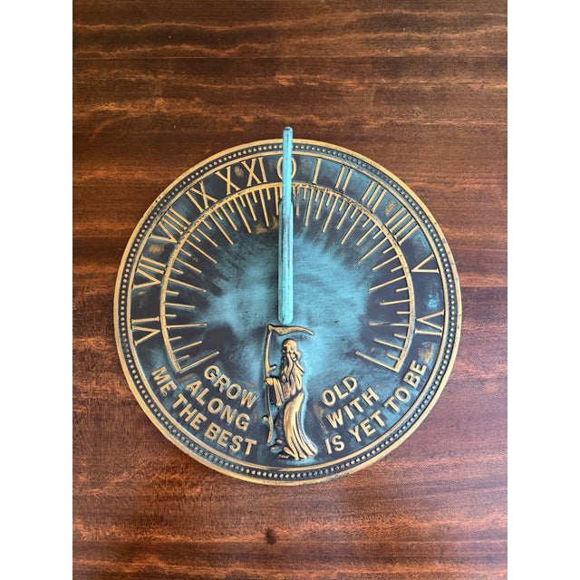 A stunning vintage iron verdigris garden sundial reading "Grow old along with me. The best is yet to be." USA, Late 20th...