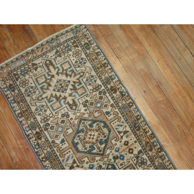 Very narrow one of a kind Persian Heriz runner from the second quarter of the 20th century. Blue, brown tones on an ivory...