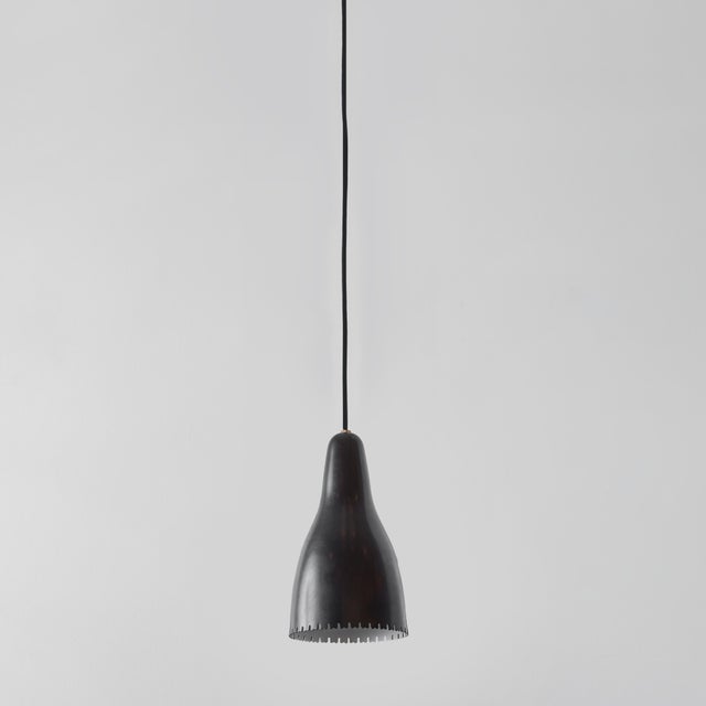 1950s Bent Karlby Black Painted Metal & Brass Pendant Lamp for Lyfa. Executed in architecturally cut and elegantly shaped...