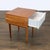 This West Elm nightstand features a warm wood finish and a unique white textured drawer front. The table includes one...