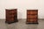 An Italian pair of small serpentine side chests, with decorative inlay, veneers, and banding, from the 19th century. These...