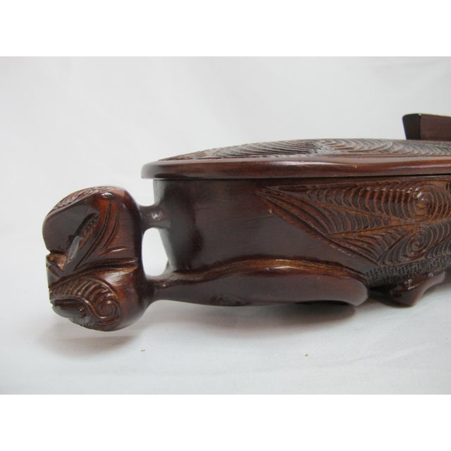 Traditional vintage Māori Waka Huia, a carved wooden treasure or feather box from New Zealand. Crafted from native timbers...