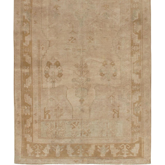Vintage Turkish Oushak rug, handwoven of wool, featuring an allover design in a beautifully neutral color palette....