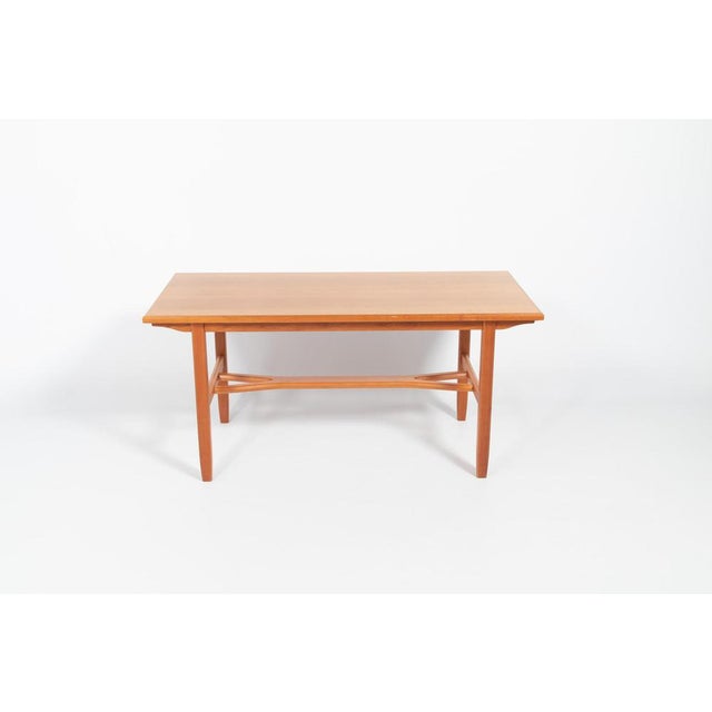 Elegant extendable varnished maple coffee table from 1960s from Åfors Möbelfabrik. This table will serve well as a coffee...