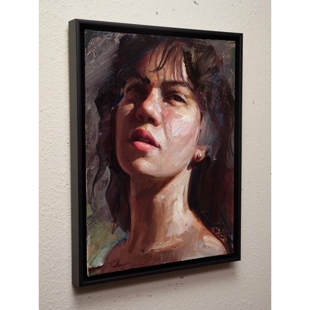 This oil painting on linen panel captures a contemplative figure, bathed in soft, natural light that accentuates the...