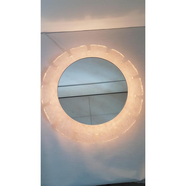 Round mirror with an acrylic edge that looks like ice glass. The mirror has 5 light points on the back, which illuminates...