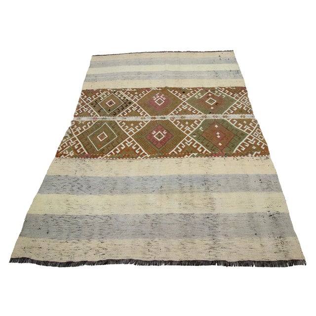 Decorative handwoven vintage kilim rug from Marash region of Turkey. Approximately 50-60 years old. In very good condition.