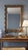 The Vail Wall Mirror features an ornate gold resin frame with sculpted detailing and beveled glass that bring a warm,...